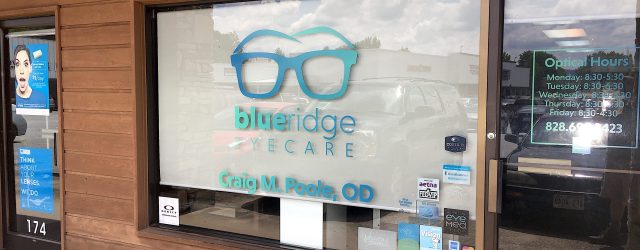 Picture of store window, big Glasses logo