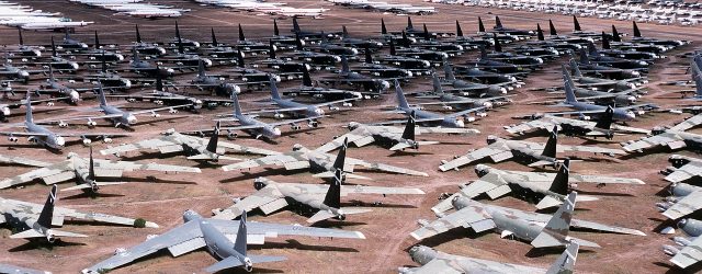 Hundreds of airplanes lined up on tarmac for storage